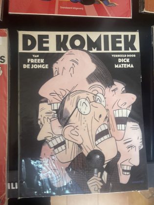 Cover van De komiek